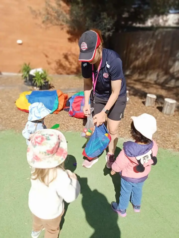 A Kindoo educator leading an activity with children